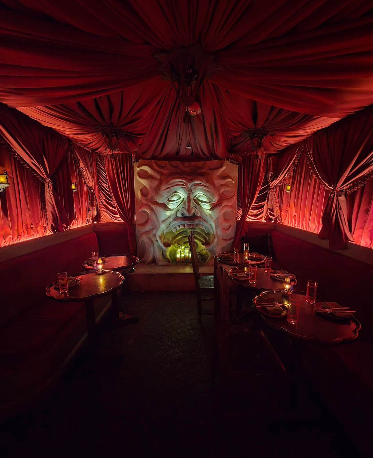Red ceiling drapery installation in a restaurant